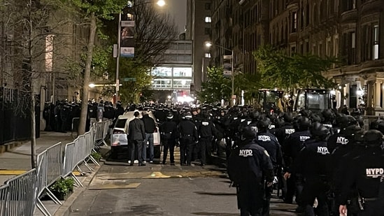 New York police officers move towards an entrance to Columbia University, Tuesday, April 30, 2024, in New York. After entering the campus, a contingent of police officers approached Hamilton Hall, the administration building that student protesters began occupying in the morning. (AP Photo/Julius Motal)(AP)