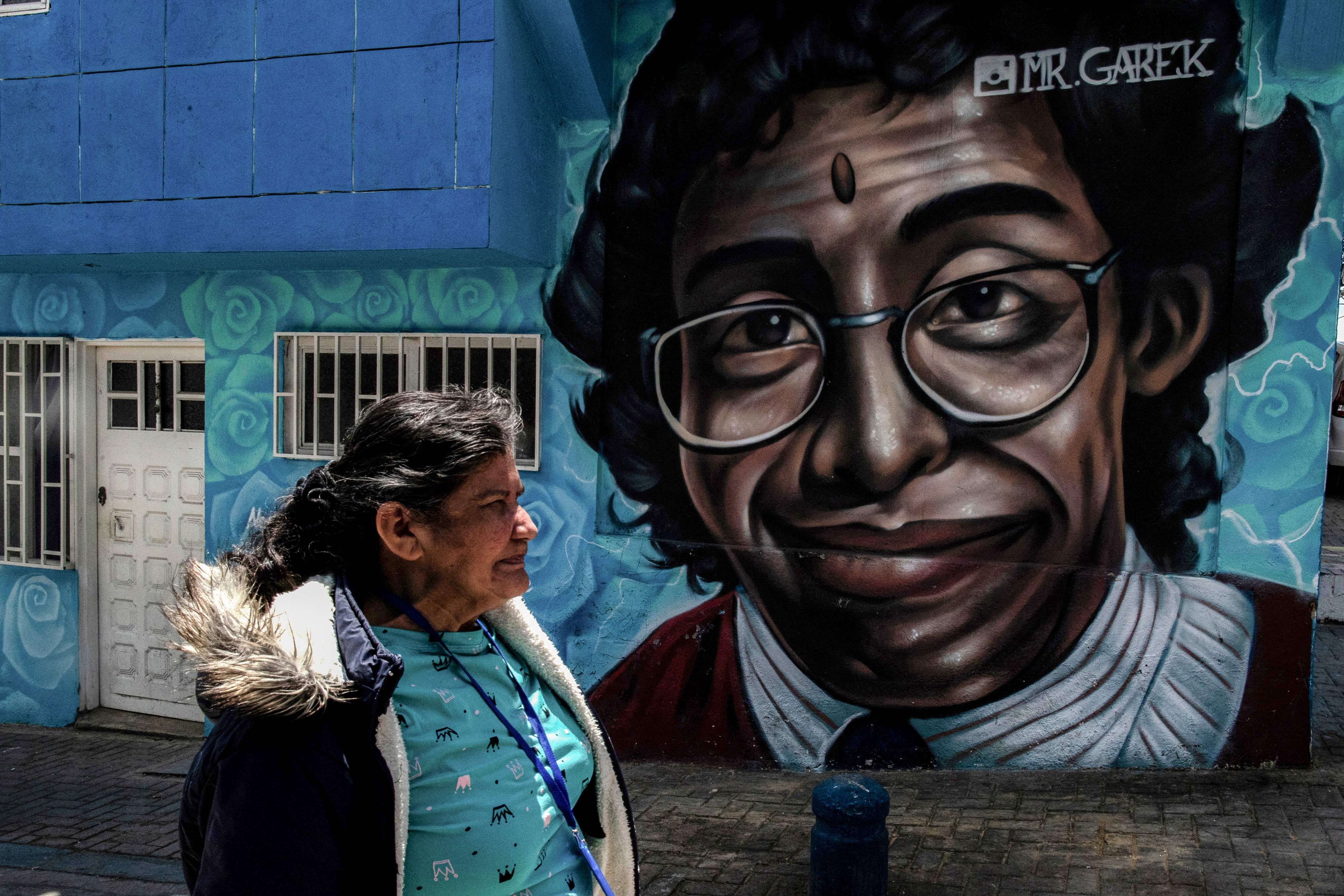 Tourists are flocking to Ciudad Bolivar to ride the TransMiCable cable car, visit the 'Street of Color' with vibrant murals, and explore the 'Self-Built City' museum.(AFP)