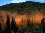Smoke from smoke grenades rise through the forest during a disaster risk training exercise to effectively deal with wildfires, in Athens, Greece. Travelling to Greece this summer? Watch out for intense wildfire threat amid climate change warning 