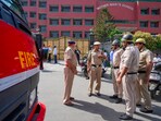 Delhi school bomb threat news: Police and fire department personnel outside Mother Mary's School at Mayur Vihar, in New Delhi on Wednesday. Delhi school bomb threat news: Police and fire department personnel outside Mother Mary's School at Mayur Vihar, in New Delhi on Wednesday.