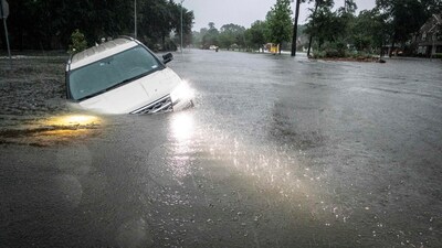 An SUV stranded in a ditch in a stretch of street flooding during a severe storm in Texas. (AP) An SUV stranded in a ditch in a stretch of street flooding during a severe storm in Texas. (AP)