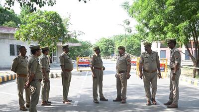 Armed police are guarding the EVM strong rooms at Phool Mandi in Noida’s Phase 2. Political parties too have deployed their representatives at the market to keep strict vigil until counting day on June 4. (Sunil Ghosh/HT Photo) Armed police are guarding the EVM strong rooms at Phool Mandi in Noida’s Phase 2. Political parties too have deployed their representatives at the market to keep strict vigil until counting day on June 4. (Sunil Ghosh/HT Photo)