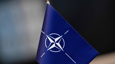 A flag with the logo of the North Atlantic Treaty Organization (NATO) (AFP)