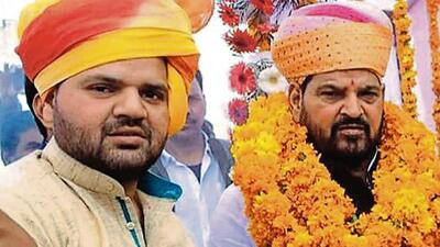 BJP MP Brij Bhushan Sharan Singh with his son Karan Bhushan. (FILE PHOTO) BJP MP Brij Bhushan Sharan Singh with his son Karan Bhushan. (FILE PHOTO)