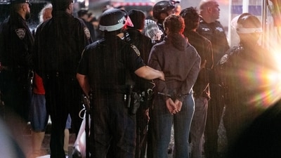 FILE - As light rain falls, New York City police officers take people into custody near the Columbia University campus in New York, Tuesday, April 30, 2024, after a building taken over by protesters earlier in the day was cleared, along with a tent encampment. (AP Photo/Craig Ruttle, File) (AP) FILE - As light rain falls, New York City police officers take people into custody near the Columbia University campus in New York, Tuesday, April 30, 2024, after a building taken over by protesters earlier in the day was cleared, along with a tent encampment. (AP Photo/Craig Ruttle, File) (AP)