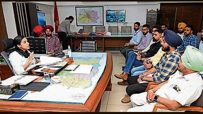 DEO Sakshi Sawhney and assistant expenditure observers during a meeting in Ludhiana on Thursday. (HT Photo) DEO Sakshi Sawhney and assistant expenditure observers during a meeting in Ludhiana on Thursday. (HT Photo)
