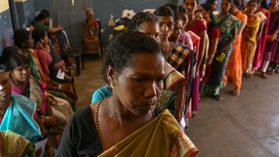 People from Kattunayakar tribe stand in a queue to cast their ballot at a polling station during the second phase of voting of India's general election in Wayanad district in Kerala on April 26, 2024. (Photo by R. Satish BABU / AFP) (AFP) People from Kattunayakar tribe stand in a queue to cast their ballot at a polling station during the second phase of voting of India's general election in Wayanad district in Kerala on April 26, 2024. (Photo by R. Satish BABU / AFP) (AFP)