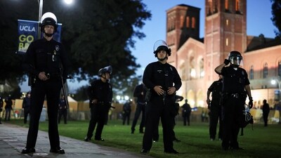 Law enforcement officers take position before entering the pro-Palestinian protest encampment at the University of California Los Angeles (UCLA), as the conflict between Israel and the Palestinian Islamist group Hamas continues (REUTERS)