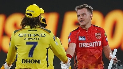 Punjab Kings' captain Sam Curran shakes hands with Chennai Super Kings' MS Dhoni after Punjab Kings won the Indian Premier League cricket match (AP) Punjab Kings' captain Sam Curran shakes hands with Chennai Super Kings' MS Dhoni after Punjab Kings won the Indian Premier League cricket match (AP)
