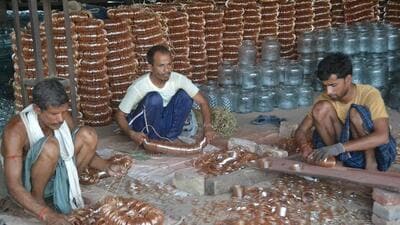 Labourers at work at a bangle unit in Firozabad. (FILE PHOTO) Labourers at work at a bangle unit in Firozabad. (FILE PHOTO)