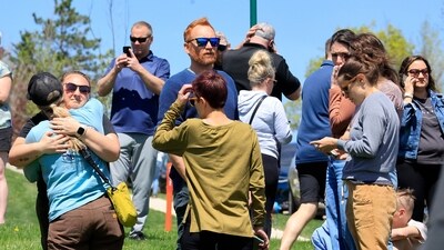 People gather at a site designated for parent and student reunifications following a report of a armed person outside Mount Horeb Middle School in Mount Horeb, Wis., Wednesday, May 1, 2024. (John Hart/Wisconsin State Journal via AP) (AP) People gather at a site designated for parent and student reunifications following a report of a armed person outside Mount Horeb Middle School in Mount Horeb, Wis., Wednesday, May 1, 2024. (John Hart/Wisconsin State Journal via AP) (AP)