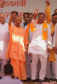 UP CM Yogi Adityanath with BJP candidate Jaiveer Singh.