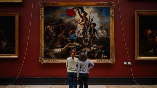 Restorers have uncovered the vibrant colours of Delacroix's "Liberty Leading the People" at the Louvre. (AFP)