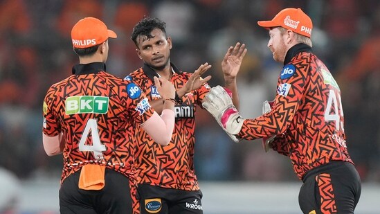 Purple Cap holder T Natarajan and skipper Cummins shared four wickets as SRH staged a late fightback(AP)