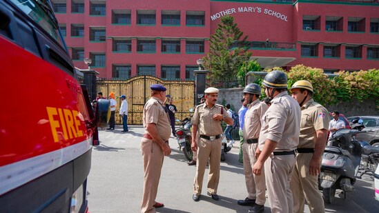 Delhi school bomb threat news: Police and fire department personnel outside Mother Mary's School at Mayur Vihar, in New Delhi on Wednesday. ( (PTI Photo/Ravi Choudhary) )