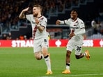 Bayer Leverkusen's Robert Andrich celebrates scoring their second goal with Jeremie Frimpong