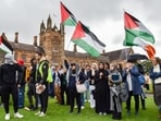 Members of the Australian Palestinian community shout slogans at the Palestinian Protest Campsite at University of Sydney. (AFP) Members of the Australian Palestinian community shout slogans at the Palestinian Protest Campsite at University of Sydney. (AFP)