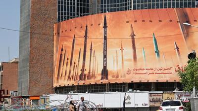 An anti-Israel billboard with a picture of Iranian missiles is seen on a street in Tehran, Iran April 19 (WANA via REUTERS)