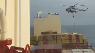 An official slides down a rope during a helicopter raid on MSC Aries ship. (HT File) An official slides down a rope during a helicopter raid on MSC Aries ship. (HT File)