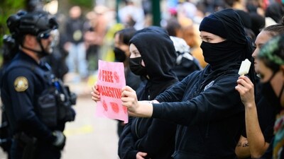 PORTLAND, OREGON - MAY 2: Pro-Palestinian protesters face-off with police at the Portland State University campus on May 2, 2024 in Portland, Oregon. Pro-Palestinian encampments have sprung up at college campuses around the country with some protestors calling for schools to divest from Israeli interests amid the ongoing war in Gaza. (Getty Images via AFP)
