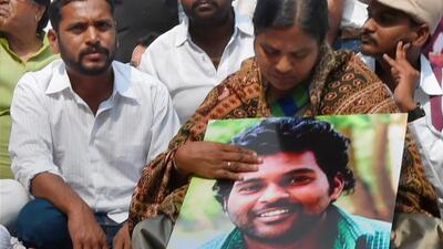 Rohith Vemula's mother Radhika Vemula holds his photo at a protest at Jantar Mantar in New Delhi on February 3, 2016. (PTI) Rohith Vemula's mother Radhika Vemula holds his photo at a protest at Jantar Mantar in New Delhi on February 3, 2016. (PTI)