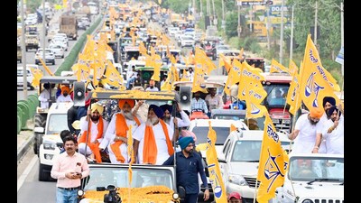 SAD president Sukhbir Singh Badal and party workers during the Punjab Bachao Yatra in Mohali on Friday. (HT photo)