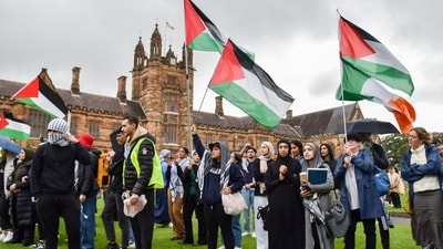Members of the Australian Palestinian community shout slogans at the Palestinian Protest Campsite at University of Sydney. (AFP) Members of the Australian Palestinian community shout slogans at the Palestinian Protest Campsite at University of Sydney. (AFP)