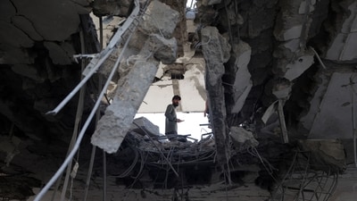 TOPSHOT - A Palestinian man stands amid the rubble of a building destroyed by Israeli bombing in Rafah in the southern Gaza Strip on May 3, 2024, as the conflict between Israel and the Hamas movement continues. (Photo by AFP) (AFP) TOPSHOT - A Palestinian man stands amid the rubble of a building destroyed by Israeli bombing in Rafah in the southern Gaza Strip on May 3, 2024, as the conflict between Israel and the Hamas movement continues. (Photo by AFP) (AFP)
