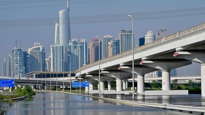 This picture shows a flooded motorway in Dubai on April 20, 2024. Four people died after the heaviest rainfall on record in the oil-rich UAE on April 16, including two Filipino women who suffocated inside their vehicle in Dubai's flooding. (Photo by Giuseppe CACACE / AFP) (AFP) This picture shows a flooded motorway in Dubai on April 20, 2024. Four people died after the heaviest rainfall on record in the oil-rich UAE on April 16, including two Filipino women who suffocated inside their vehicle in Dubai's flooding. (Photo by Giuseppe CACACE / AFP) (AFP)