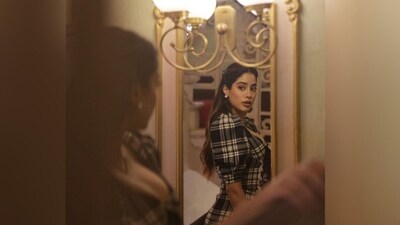 Assisted by hairstylist Marce Pedrozo, Janhvi styled her luscious locks into soft curls and left them open at the centre part, with a section of her hair pinned back and the rest left open to cascade beautifully down her shoulders. (Instagram/@janhvikapoor) Assisted by hairstylist Marce Pedrozo, Janhvi styled her luscious locks into soft curls and left them open at the centre part, with a section of her hair pinned back and the rest left open to cascade beautifully down her shoulders. (Instagram/@janhvikapoor)