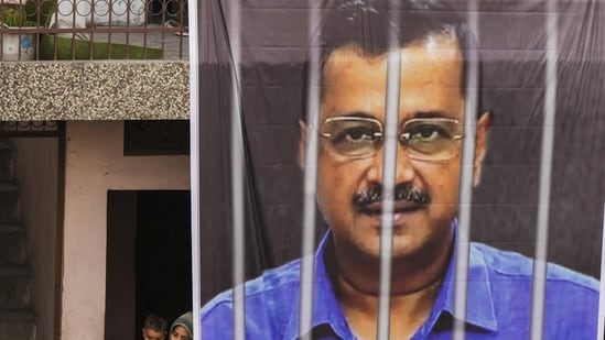 A large banner of jailed Delhi chief minister Arvind Kejriwal hangs from the balcony of a building. (PTI) A large banner of jailed Delhi chief minister Arvind Kejriwal hangs from the balcony of a building. (PTI)