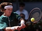 Russia's Andrey Rublev plays a return against US' Taylor Fritz. Russia's Andrey Rublev plays a return against US' Taylor Fritz.