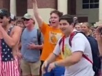 In the video, one of the white men at Ole Miss campus can be seen mocking the black protestor by making monkey gestures and noises at her during the showdown. In the video, one of the white men at Ole Miss campus can be seen mocking the black protestor by making monkey gestures and noises at her during the showdown.