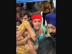 The image shows Chandrika Dixit, known as Vada Pav Girl, amid a commotion. The image shows Chandrika Dixit, known as Vada Pav Girl, amid a commotion.