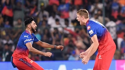 Royal Challengers Bengaluru's Cameron Green and Mohammed Siraj celebrate the wicket of Gujarat Titans' Sai Sudharsan during the match in the Indian Premier League 2024 (ANI ) Royal Challengers Bengaluru's Cameron Green and Mohammed Siraj celebrate the wicket of Gujarat Titans' Sai Sudharsan during the match in the Indian Premier League 2024 (ANI )