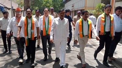 Ganesh Naik and his sons Sanjeev and Sandeep, and nephew Sagar, were among those who attended Naresh Mhaske's nomination-filing proceedings in Thane. Ganesh Naik and his sons Sanjeev and Sandeep, and nephew Sagar, were among those who attended Naresh Mhaske's nomination-filing proceedings in Thane.