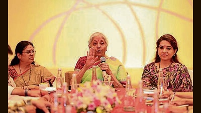 Nirmala Sitharaman (C) was speaking at an event in city. Also seen are BJP MP Medha Kulkarni (R) and leader Shaina NC. (HT PHOTO)