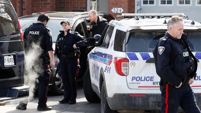 Ottawa Police Service officers surround a home after four children and two adults were found dead inside a neighbouring house in the Ottawa suburb of Barrhaven, Ontario, Canada March 7, 2024. REUTERS/Blair Gable (REUTERS)
