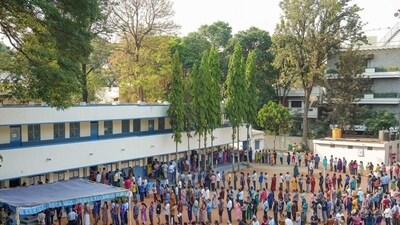 Voters at a polling station in Bengaluru. (PTI)