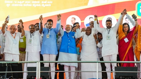 Mysuru: Prime Minister Narendra Modi, JD(S) Supremo and former PM H D Devegowda, BJP leaders B S Yediyurappa, Sumalatha and NDA candidates Yaduveer, Balraj, H D Kumaraswamy and Prajwal Revanna during an election campaign rally ahead of Lok Sabha election in Mysuru, Sunday, April 14, 2024. (PTI Photo/Shailendra Bhojak) (PTI04_14_2024_000285A) (PTI)
