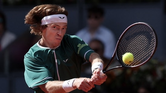 Russia's Andrey Rublev plays a return against US' Taylor Fritz. (AFP)