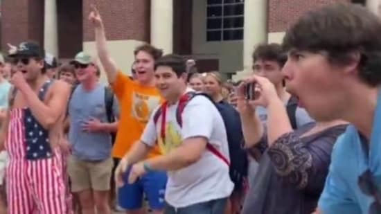 In the video, one of the white men at Ole Miss campus can be seen mocking the black protestor by making monkey gestures and noises at her during the showdown. (X)