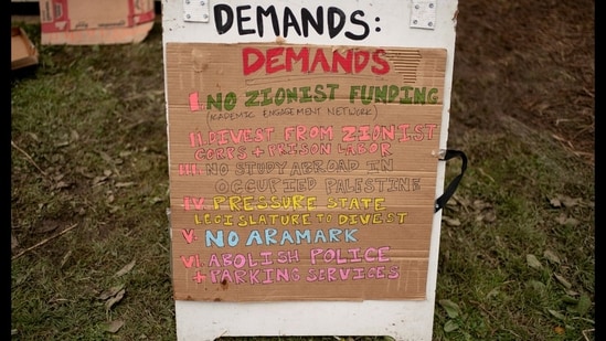 A sign listing protesters' demands is displayed at a protest encampment in support of Palestinians, during the ongoing conflict between Israel and the Palestinian Islamist group Hamas, at Evergreen State College in Olympia, Washington, U.S. April 28, 2024 (REUTERS/David Ryder)