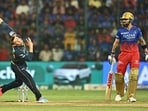 Gujarat Titans' Noor Ahmad (L) bowls as Royal Challengers Bengaluru's Virat Kohli watches during the Indian Premier League (IPL) Twenty20 cricket match between Royal Challengers Bengaluru and Gujarat Titans Gujarat Titans' Noor Ahmad (L) bowls as Royal Challengers Bengaluru's Virat Kohli watches during the Indian Premier League (IPL) Twenty20 cricket match between Royal Challengers Bengaluru and Gujarat Titans