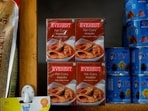 Boxes of Everest fish curry masala are stacked on the shelf of a shop at a market in Srinagar. 