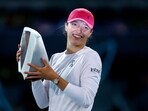 Poland's Iga Swiatek celebrates with the trophy after winning her final match against Belarus' Aryna Sabalenka