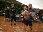 Residents were evacuated from the flooded zones of Porto Alegre, Rio Grande do Sul, Brazil on Saturday. Civil defence authorities report 74 injuries and 67 people missing as a consequence of the catastrophic flooding.(AFP)