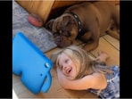 Snapshot of the girl with her pet dog. 