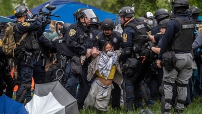 Police lift a pro-Palestinian demonstrator from the ground on the University of Virginia campus, in Charlottesville, Va., where tents are set up, Saturday, May 4, 2024. (Cal Cary/The Daily Progress via AP) (AP) Police lift a pro-Palestinian demonstrator from the ground on the University of Virginia campus, in Charlottesville, Va., where tents are set up, Saturday, May 4, 2024. (Cal Cary/The Daily Progress via AP) (AP)