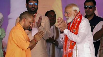 Prime Minister Narendra Modi with Uttar Pradesh chief minister Yogi Adityanath during a public meeting for the Lok Sabha elections, in Etawah on Sunday. (PTI PHOTO) Prime Minister Narendra Modi with Uttar Pradesh chief minister Yogi Adityanath during a public meeting for the Lok Sabha elections, in Etawah on Sunday. (PTI PHOTO)